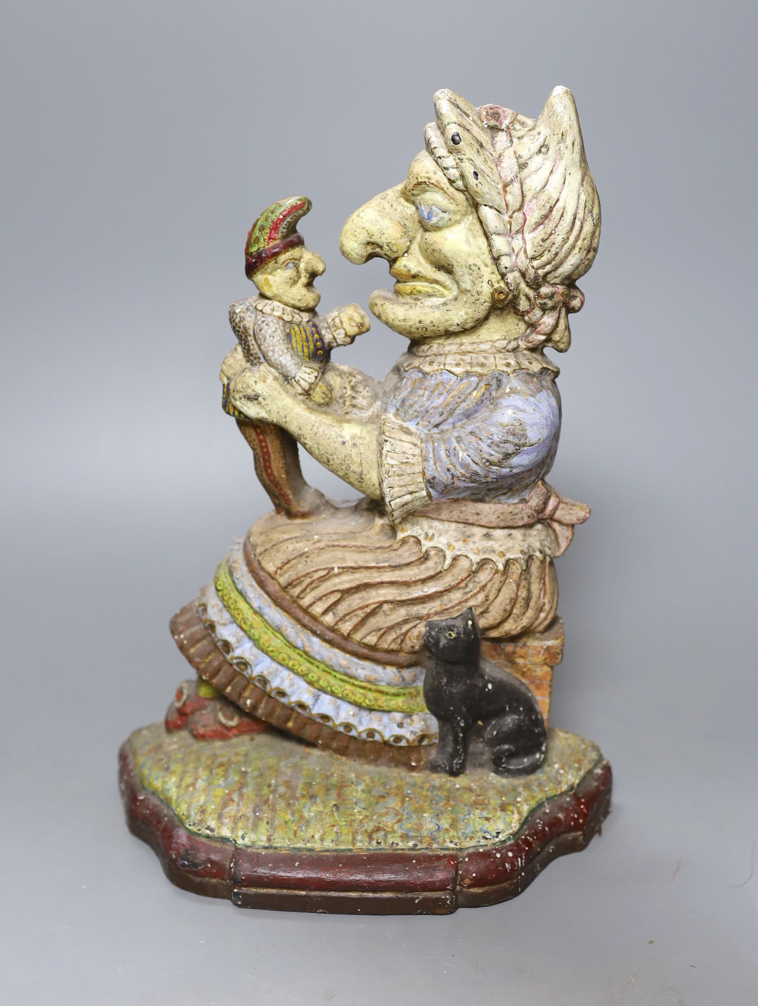 A Victorian painted cast iron Punch and Judy doorstop, 31 cms high.